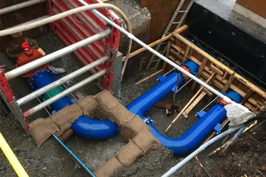 In-ground pipe tie-in for a distribution upgrade in Surrey